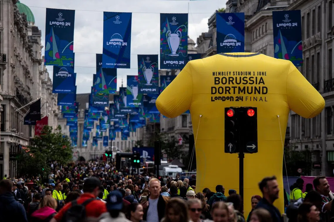 Football fans attend the UEFA Champions League Festival on Regent Street in London, Britain, May 30, 2024. REUTERS/Chris J. Ratcliffe