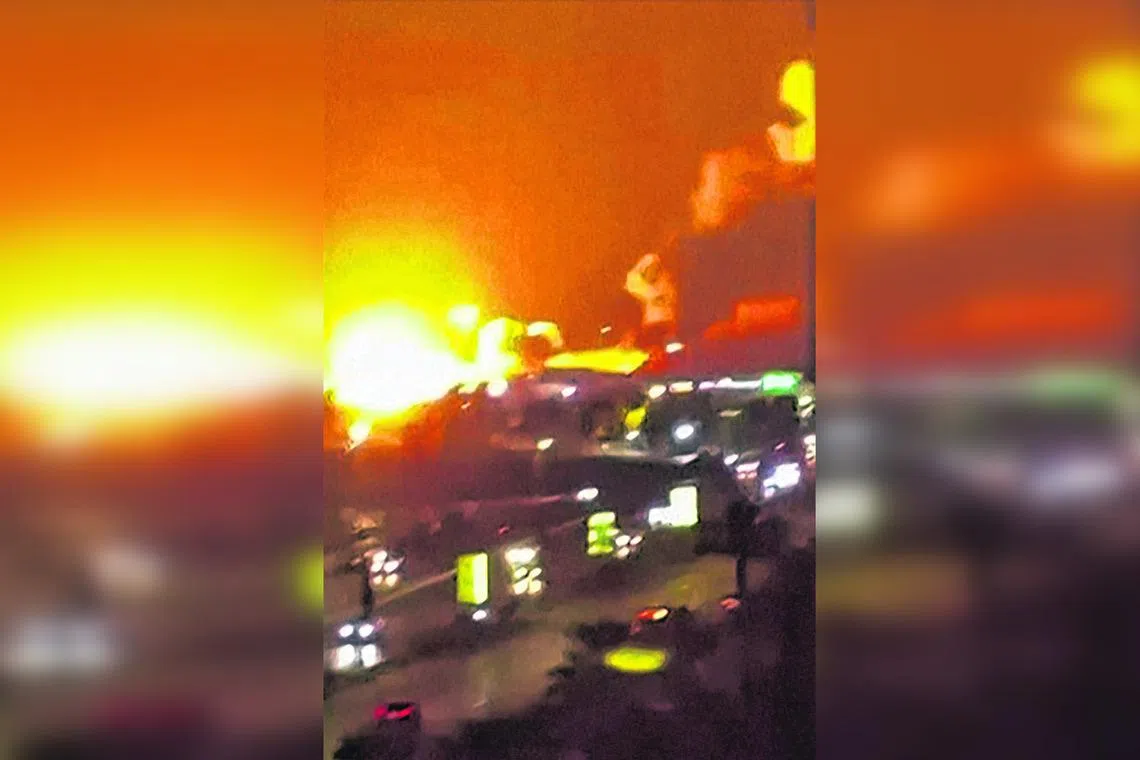 A video frame grab shows explosions going off in Iran‘s major port city of Bandar Abbas.