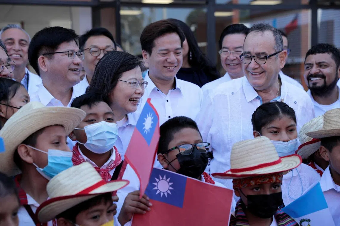 Taiwan President Tsai Ing-wen with her Guatemalan counterpart Alejandro Giammattei (second from right) during a visit to a hospital in Chimaltenango, Guatemala, on Sunday. 