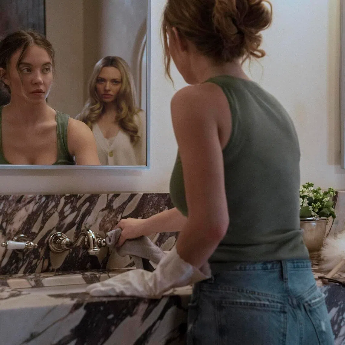 From left: Sydney Sweeney as Millie and Amanda Seyfried as Nina in
The Housemaid.