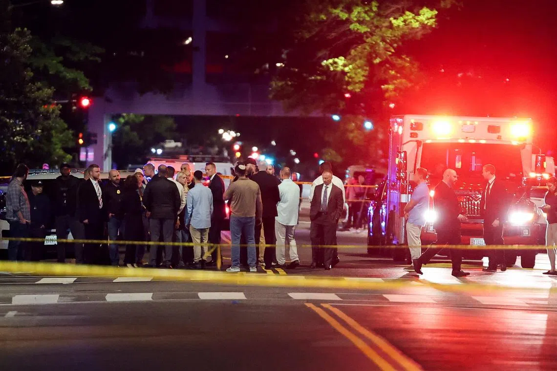 U.S. Attorney General Pam Bondi and Israeli Ambassador to the U.S. Yechiel Leiter speak to the law enforcement officials as they visit the site where, according to the U.S. Homeland Security Secretary, two Israeli embassy staff were shot dead near the Capital Jewish Museum in Washington, D.C., U.S. May 22, 2025.  REUTERS/Jonathan Ernst