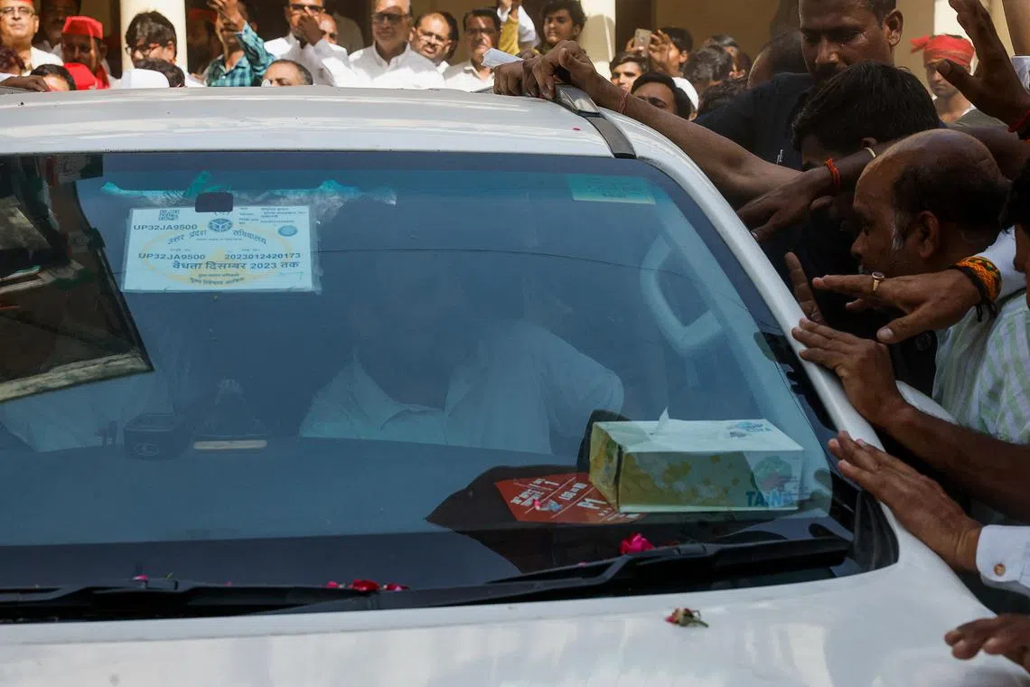 Rahul Gandhi, a senior leader of India's main opposition Congress party, looks at his supporters from a car after filing his nomination papers to contest the 2024 Lok Sabha election from the Raebareli constituency, in Raebareli, India May 3, 2024. REUTERS/Francis Mascarenhas