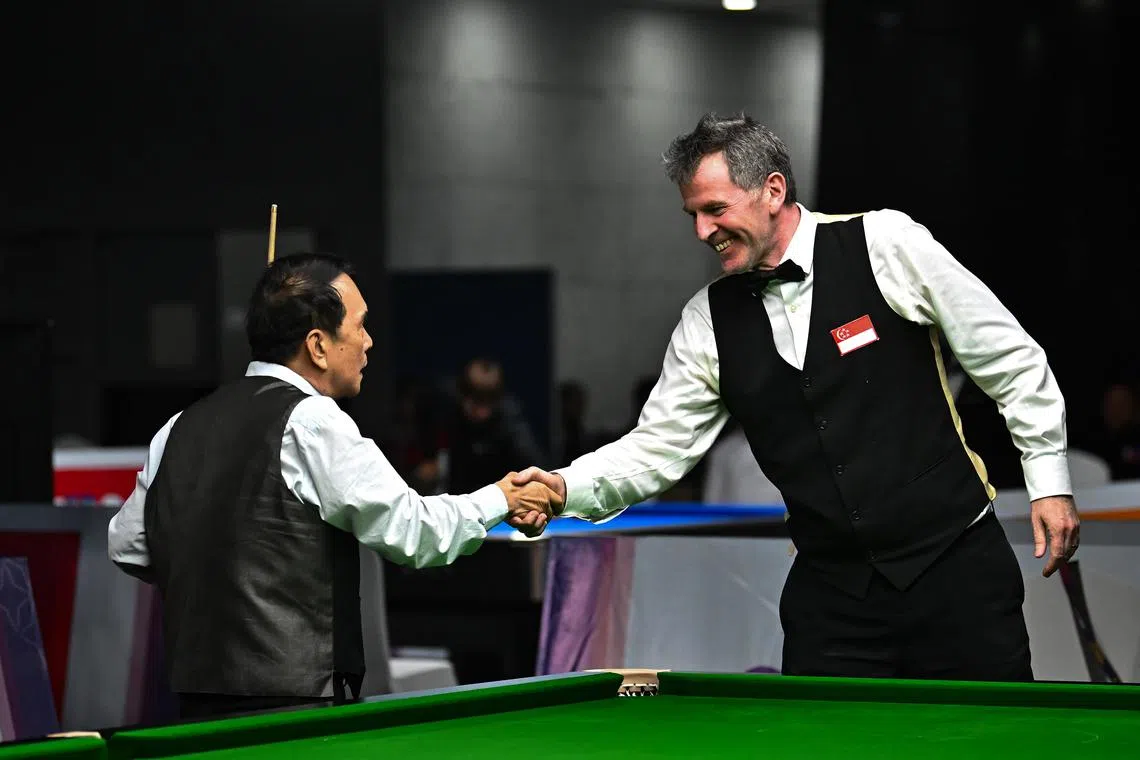 ST20230509-202320591856-Lim Yaohui-dlpeter09/
Peter Edward Gilchrist from Singapore shaking hand with Pauk Sa from Myanmar after losing the game. Peter Edward Gilchrist from Singapore against Pauk Sa from Myanmar in the final of the New English Billiard Singles at Aeon Mall Sen Sok in Phnom Penh, Cambodia on May 9, 2023. Myanmar beat Singapore 3-0 and Singapore won the silver medal.
The 2023 Southeast Asian Games, commonly known as the 32nd Southeast Asian Games, or the 32nd SEA Games, and commonly known as Cambodia 2023, will be the 32nd edition of the Southeast Asian Games, a biennial sports multi-sport event which will be held from 5 to 17 May 2023 in Phnom Penh, Cambodia.
(ST PHOTO: LIM YAOHUI)