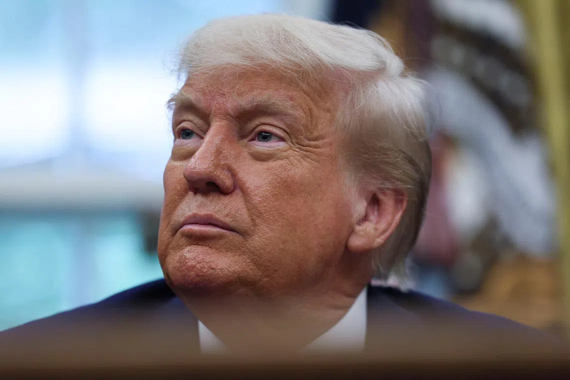 U.S. President Donald Trump listens to questions as he makes an announcement about a trade deal with the U.K., in the Oval Office at the White House in Washington, D.C., U.S., May 8, 2025. REUTERS/Leah Millis
