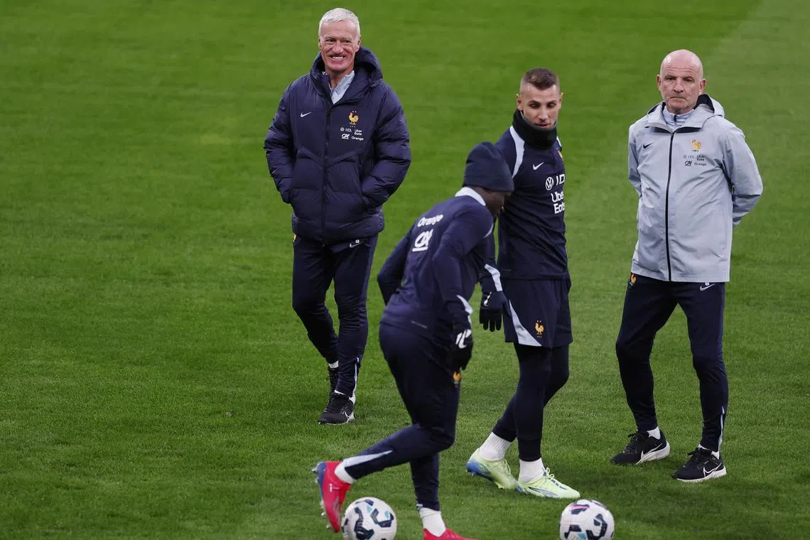 France coach Didier Deschamps, assistant coach Guy Stephan, N'Golo Kante and Lucas Digne during training at the Stade de France on Nov 13. The French take on Italy in Nations League Group A2 at the San Siro in Milan on Nov 17.