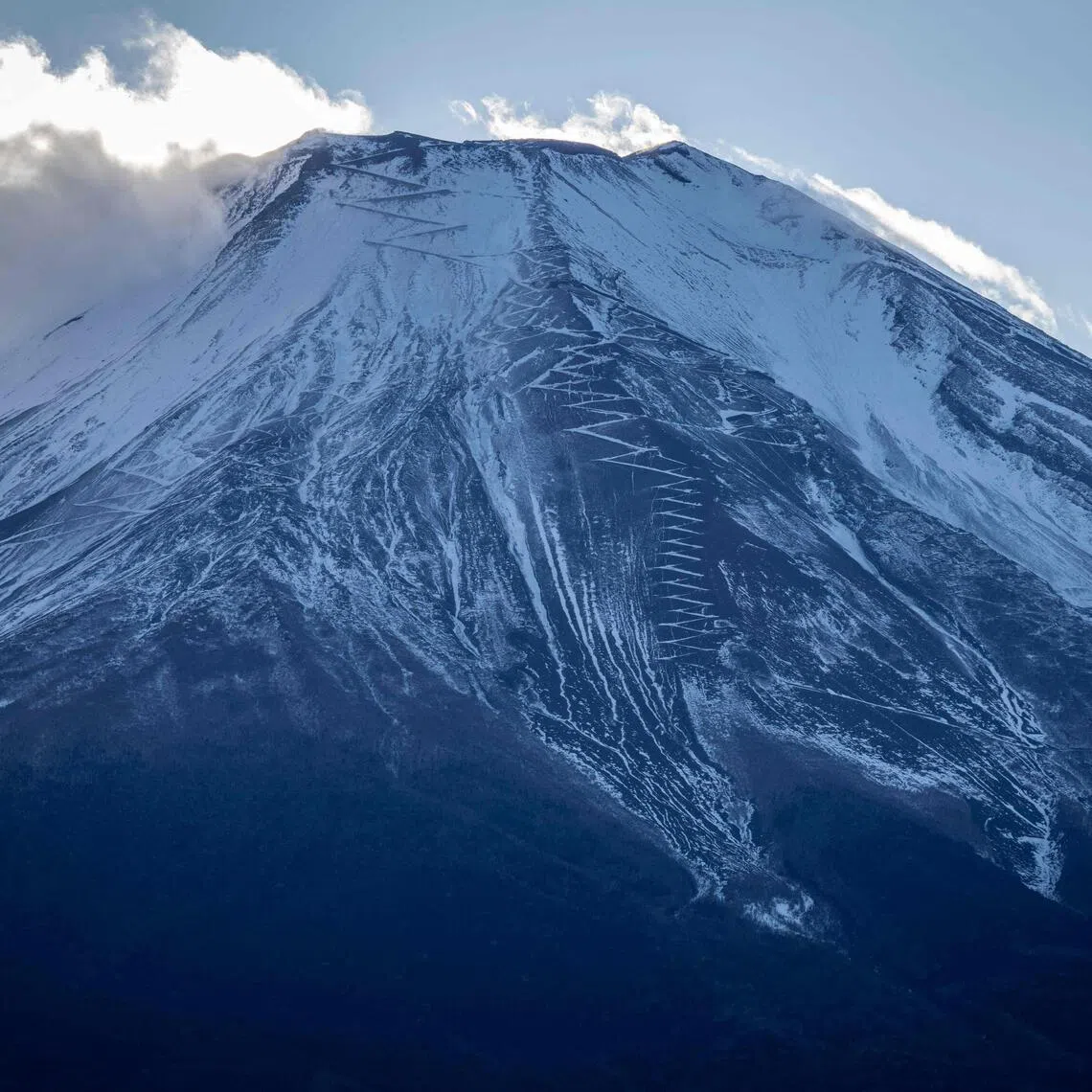 Mount Fuji is seen covered in snow in Yamanakako, Yamanashi prefecture, Japan, on Dec 5. 