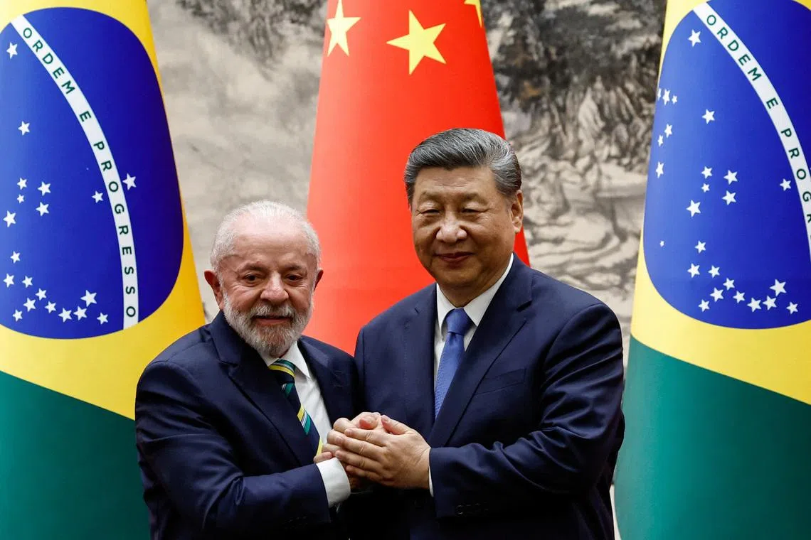 Chinese President Xi Jinping shakes hands with Brazil's President Luiz Inacio Lula da Silva at a joint press conference, at the Great Hall of the People in Beijing, China, May 13, 2025. REUTERS/Tingshu Wang/Pool/File Photo