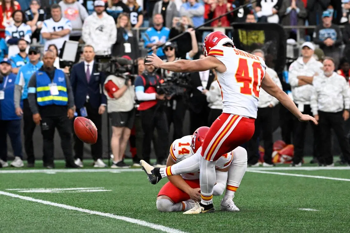 FILE PHOTO: Nov 24, 2024; Charlotte, North Carolina, USA; Kansas City Chiefs place kicker Spencer Shrader (40) kicks the winning field goal at the end of the game at Bank of America Stadium. Bob Donnan-Imagn Images/File Photo