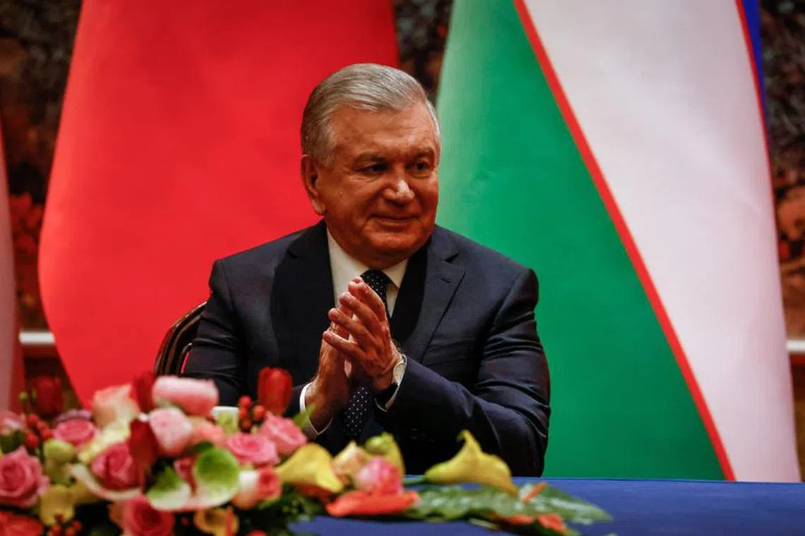 Uzbekistan President Shavkat Mirziyoyev applauds during a signing ceremony on the sidelines of the China-Central Asia Summit in Xi'an, Shaanxi province, China, May 18, 2023. Mark Cristino/Pool via REUTERS/File Photo