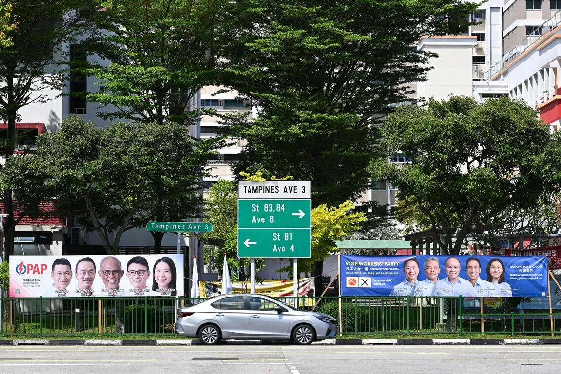 Banners for PAP and WP candidates for Tampines GRC ahead of the 2025 General Election.