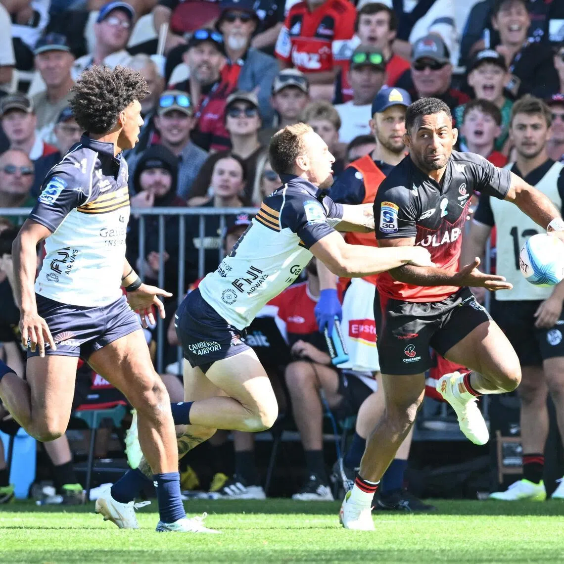 Crusaders' Sevu Reece is tackled by Brumbies' Corey Toole during the Super Rugby Pacific round-two match at Apollo Projects Stadium in Christchurch on Feb 22, 2026.