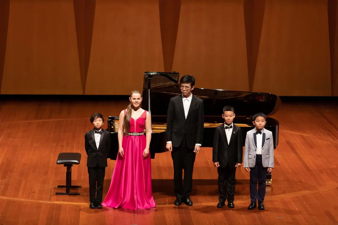 Young pianists (from left) Cheng Sio Ioi, Phoebe Papandrea, Cai Rongzhe, Gao Jingzhi and Joseph Yourong Cai. demonstrated technical ability as well as emotional nuance in their playing. 