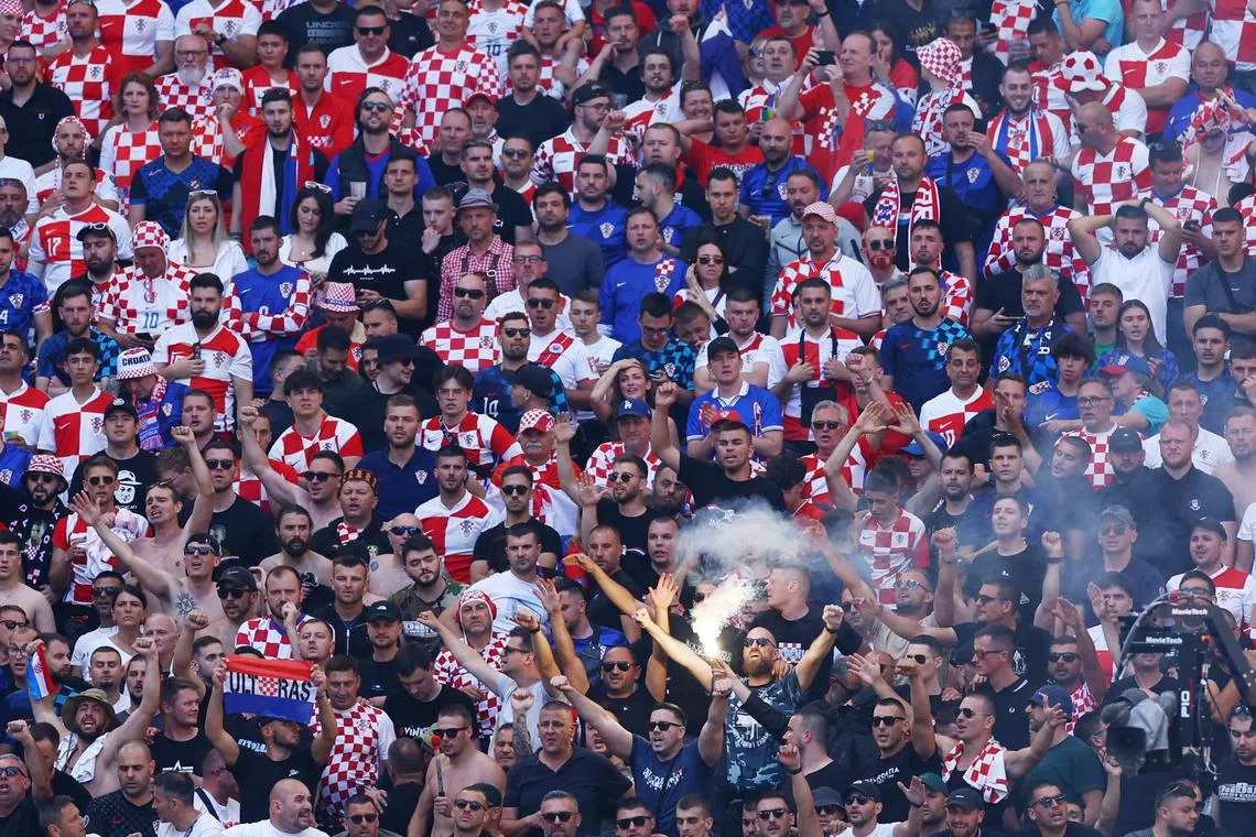 FILE PHOTO: Soccer Football - Euro 2024 - Group B - Croatia v Albania - Hamburg Volksparkstadion, Hamburg, Germany - June 19, 2024 Croatia fans let off a flare in the stands REUTERS/Lisi Niesner/File Photo