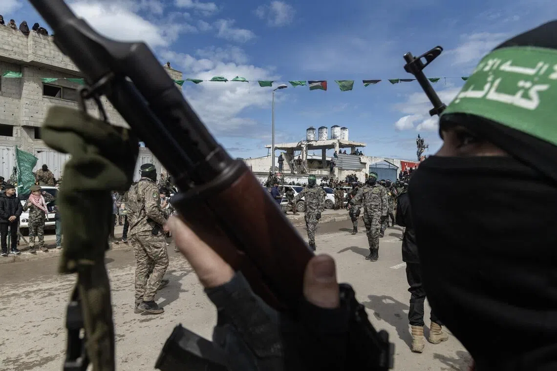 Hamas fighters during a handover of Israeli hostages in February.
