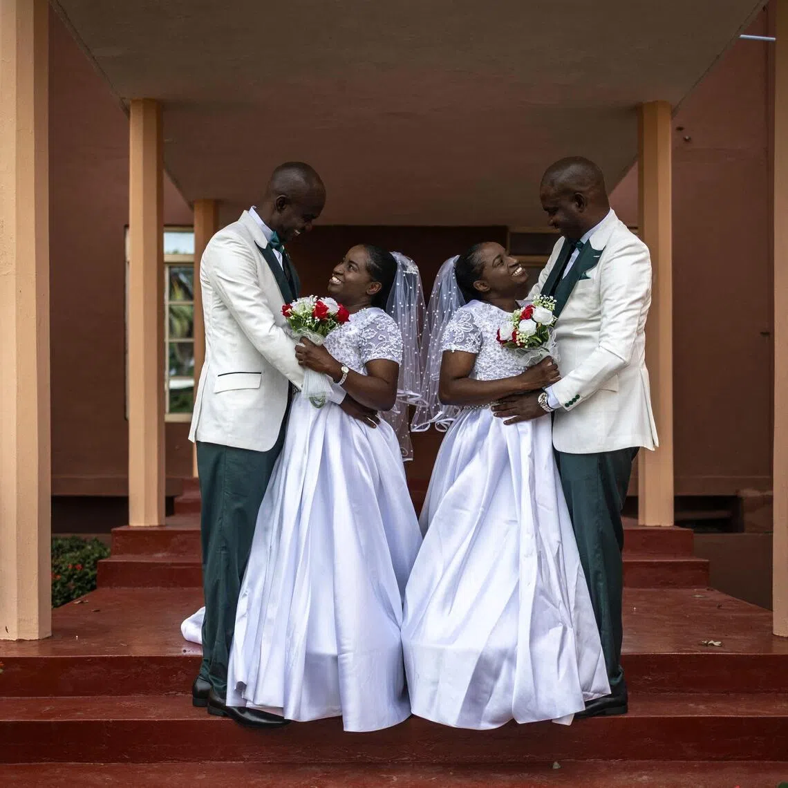 Kehinde Oguntoye and Kehinde Adediran (both left) with their twins Taiwo Adediran and Taiwo Oguntoye (both right), before their double wedding in Ibadan, Nigeria, on June 20.