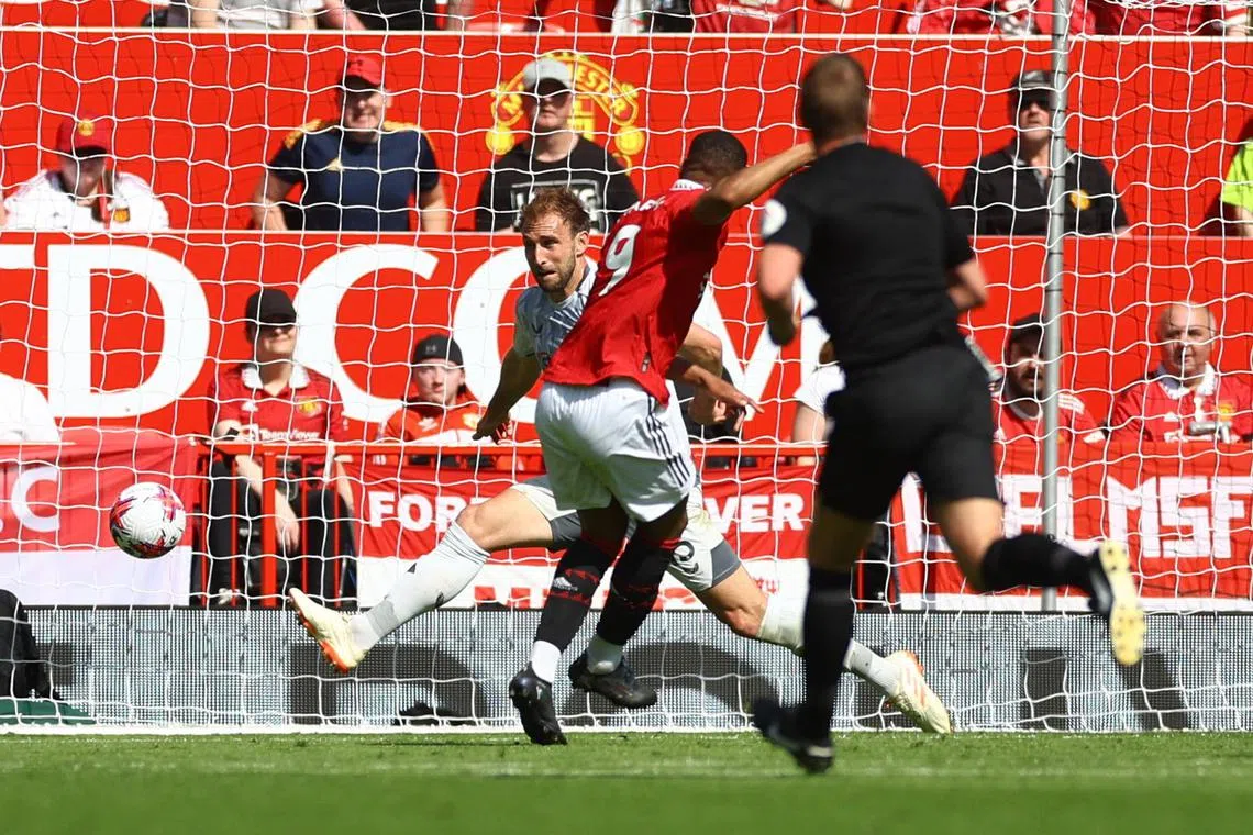 Manchester United striker Anthony Martial scoring against Wolverhampton Wanderers in the first half at Old Trafford.