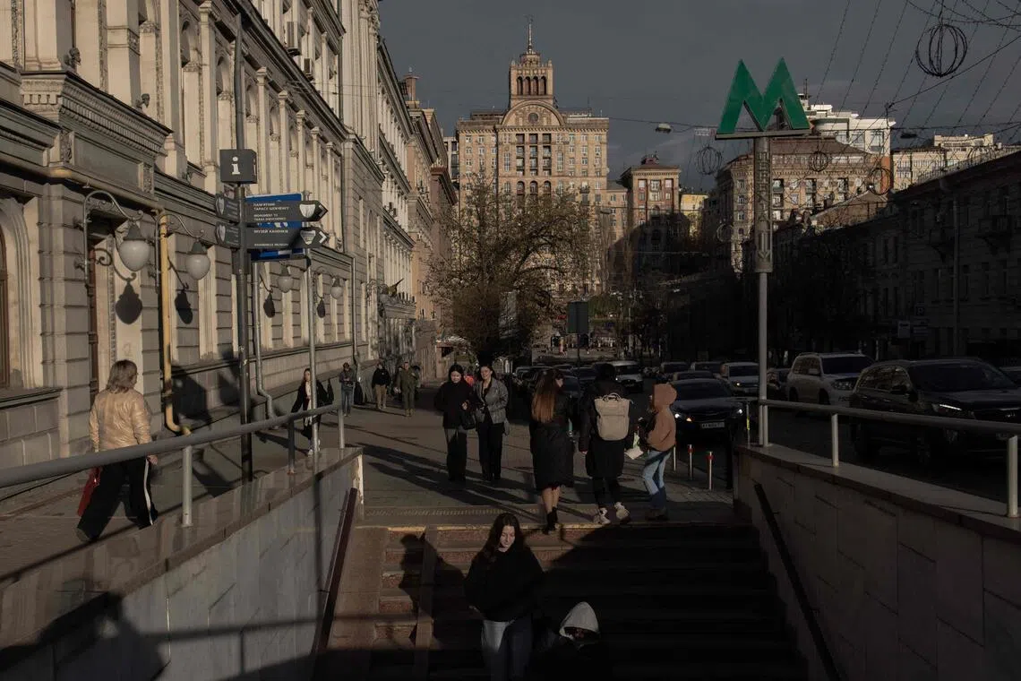 People walk on a street in downtown Kyiv, on April 6, 2026, amid the Russian invasion of Ukraine.