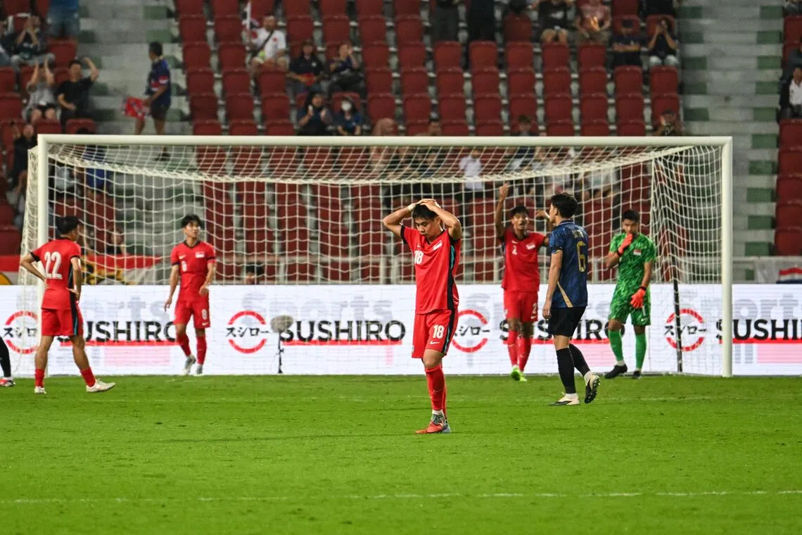 Singapore's Under-22 players react after a missed chance against Thailand  at the Rajamangala National Stadium in Bangkok, Thailand, on Dec 11, 2025.