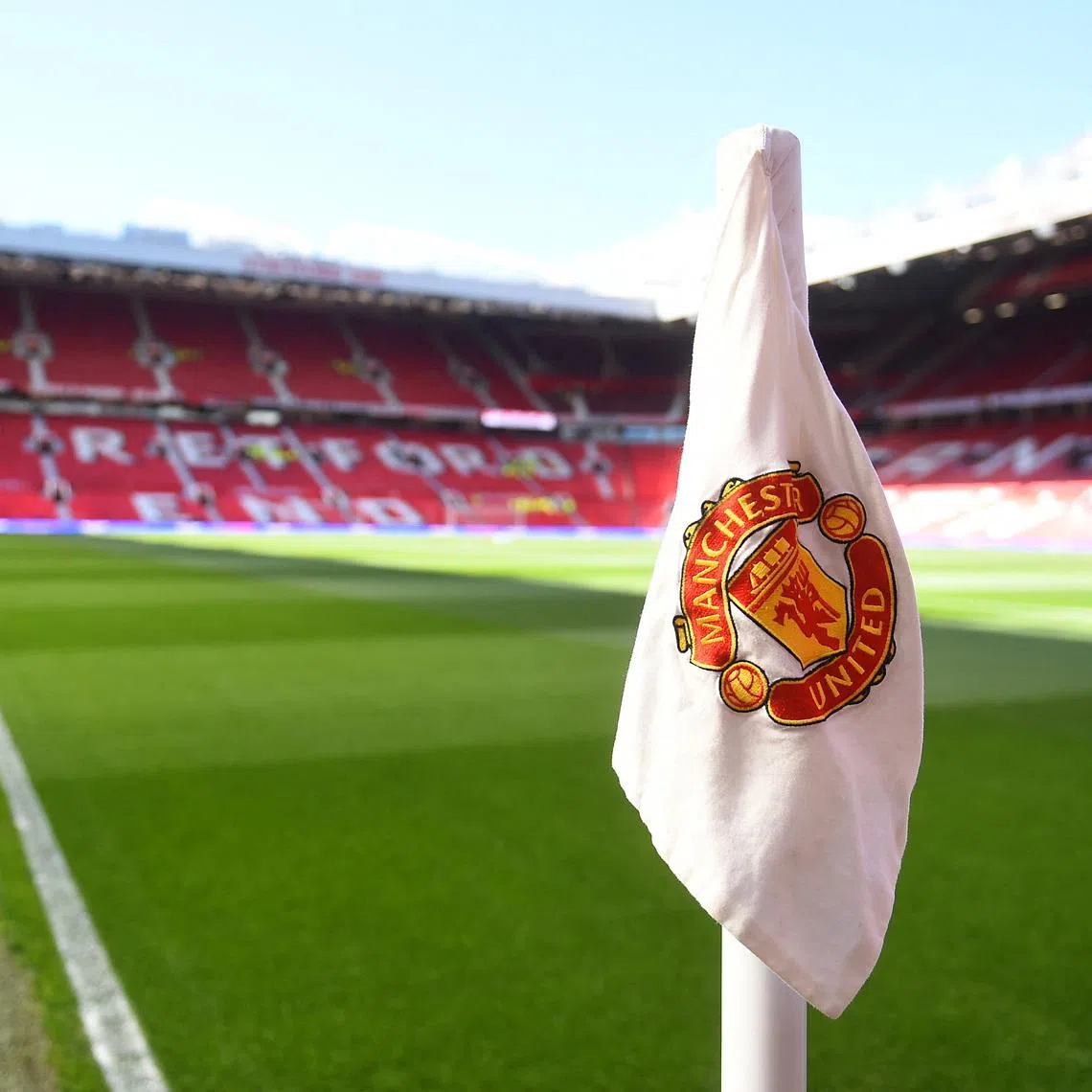 FILE PHOTO: Soccer Football - Premier League - Manchester United v Manchester City - Old Trafford, Manchester, Britain - April 6, 2025  General view of a corner flag with the Manchester United emblem before the match REUTERS/Peter Powell/ File Photo