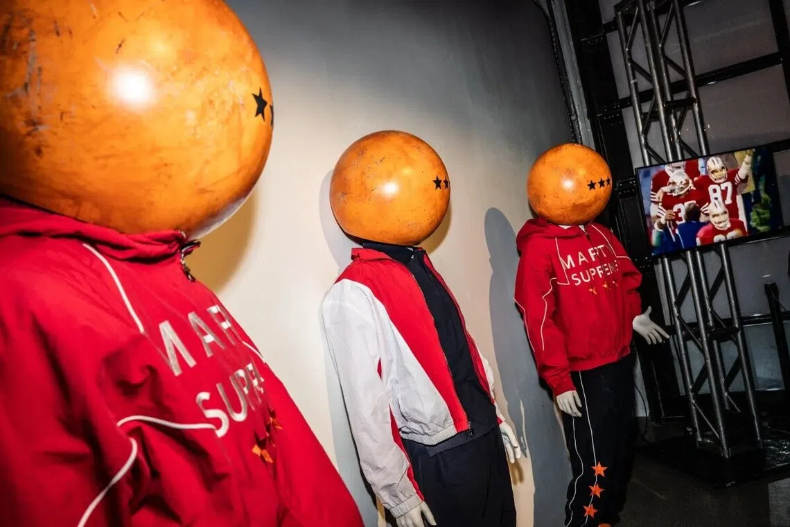 A team of ping-pong-ball-helmeted accomplices led by Timothee Chalamet into a pop-up for his upcoming movie Marty Supreme.