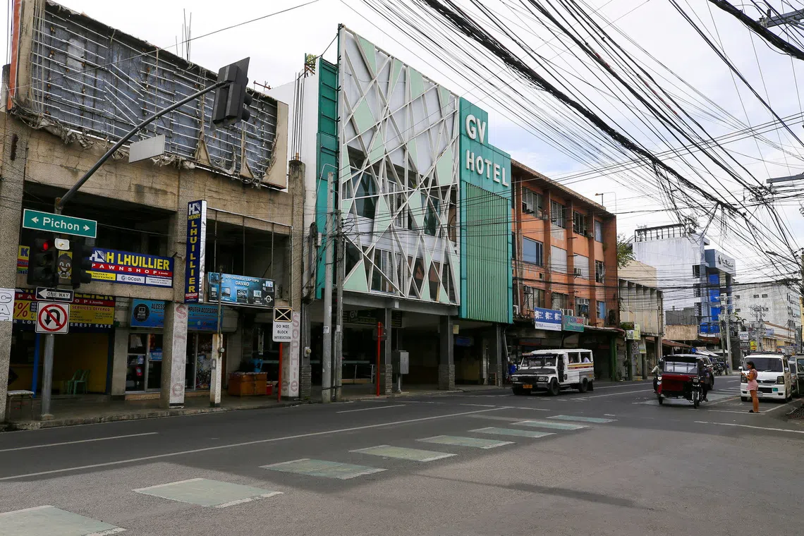Vehicles pass next to the exterior of GV Hotel where the suspected gunmen from Sydney's Bondi Beach shooting attack at a Hanukkah event had allegedly stayed when they travelled to the Philippines last month, in Davao City, Philippines, December 17, 2025. REUTERS/Marconi B. Navales