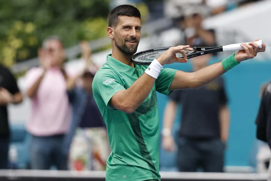 Mar 28, 2025; Miami, FL, USA; Novak Djokovic (SRB) celebrates toward his player's box after his match against Grigor Dmitrov (BUL)(not pictured) in a men's singles semifinal on day eleven of the Miami Open at Hard Rock Stadium. Mandatory Credit: Geoff Burke-Imagn Images