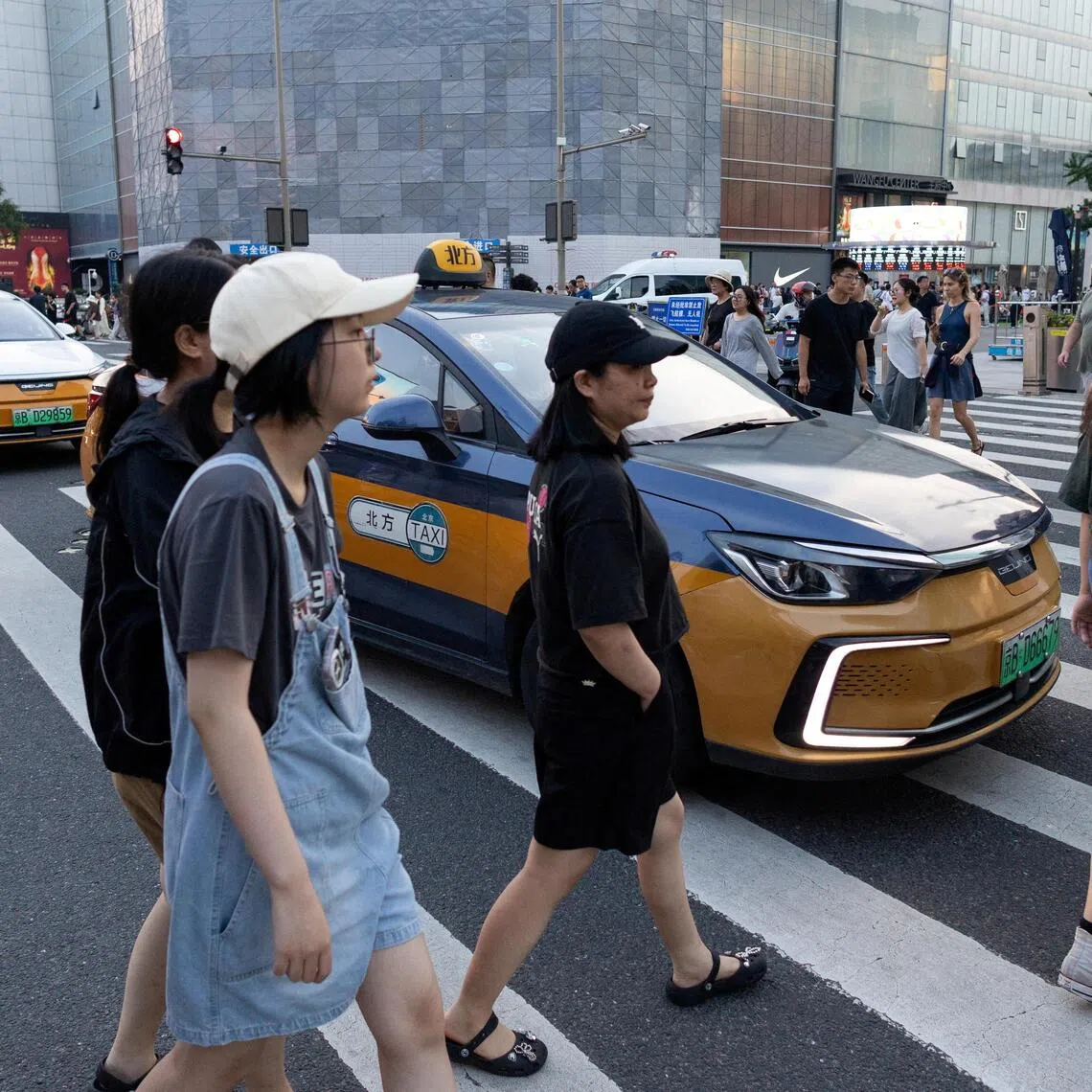 Economists say strengthening the social safety net is crucial for China to encourage household consumption in the long term.