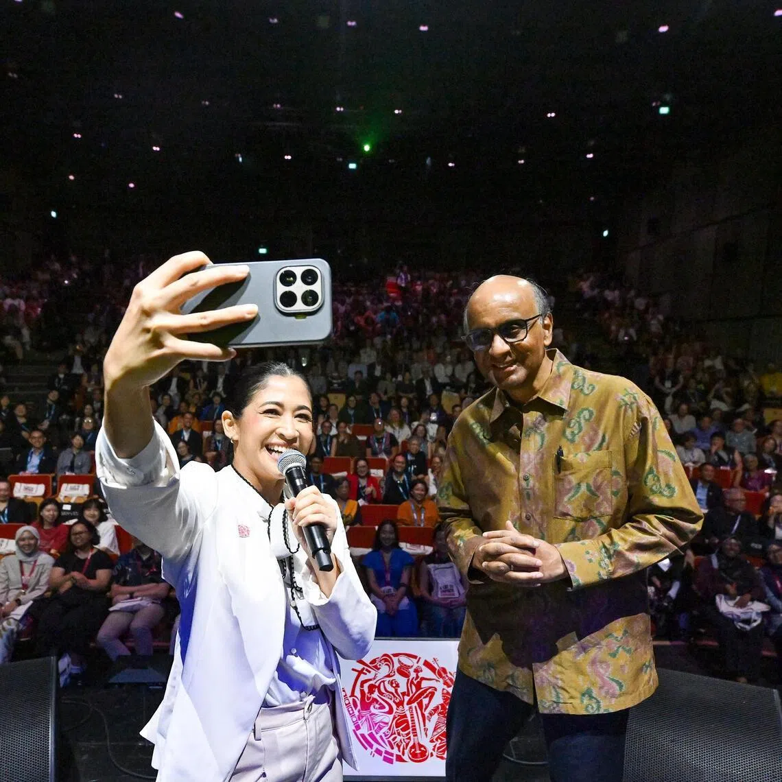 President Tharman Shanmugaratnam on stage at the International Society for the Performing Arts (ISPA) congress at the Singtel Waterfront Theatre. With him is emcee Munah Bhagarib. 