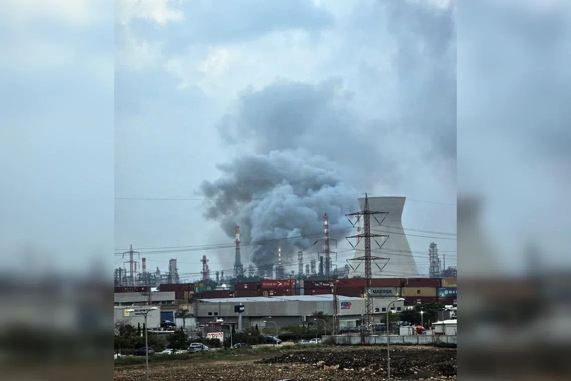 Smoke rising from an oil refinery that was damaged in an Iranian attack, in Haifa, Israel, on March 19.