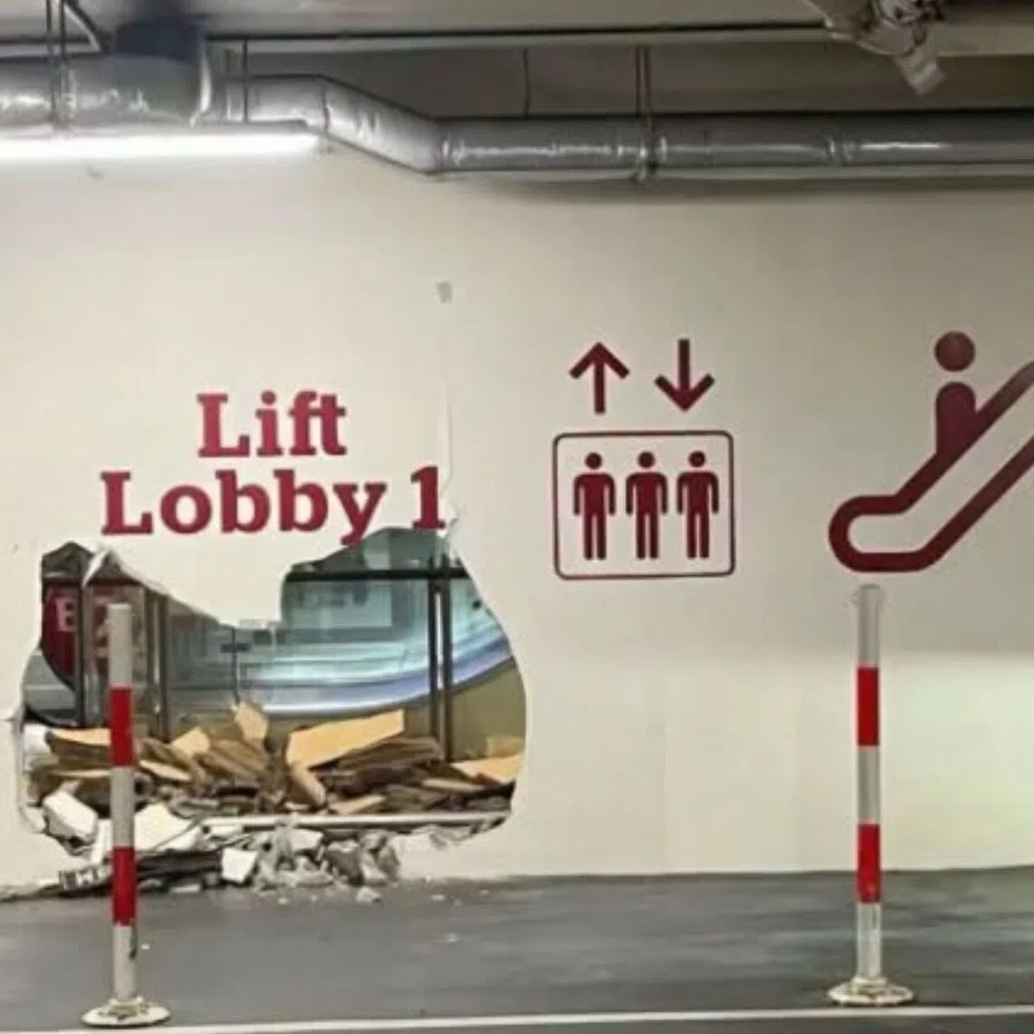 A vehicle had collided with a wall panel near a lift lobby.