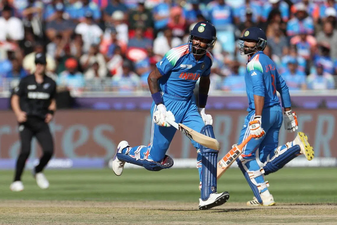 FILE PHOTO: Cricket - ICC Men's Champions Trophy - Group A - India v New Zealand - Dubai International Stadium, Dubai, United Arab Emirates - March 2, 2025 India's Hardik Pandya and Ravindra Jadeja in action REUTERS/Satish Kumar/File Photo