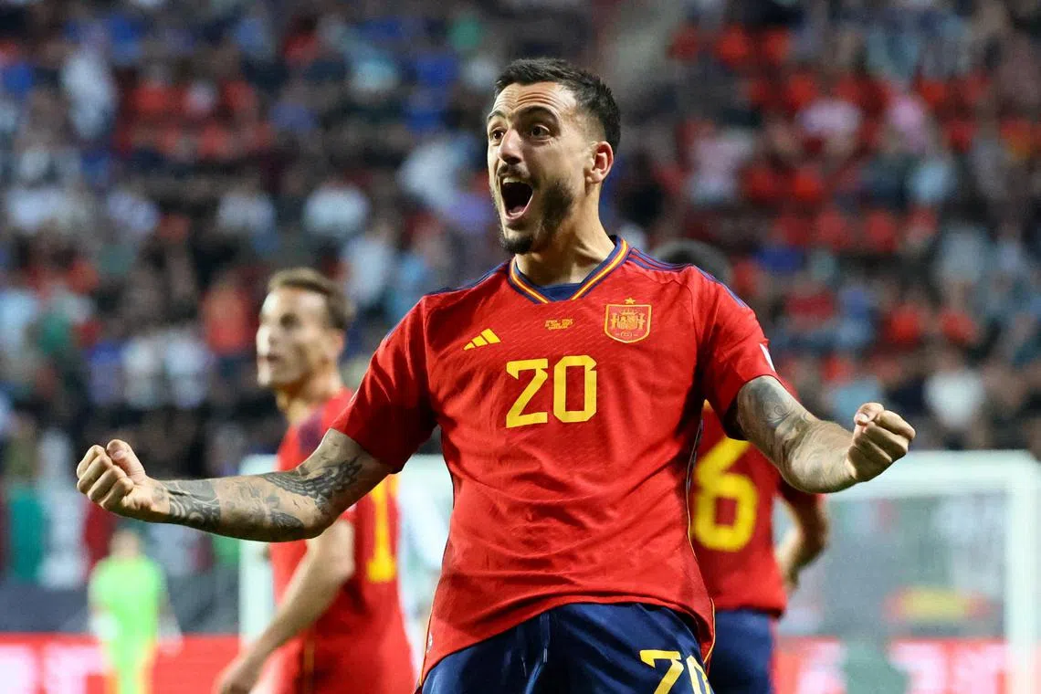 Spain's Joselu celebrates scoring their second goal.