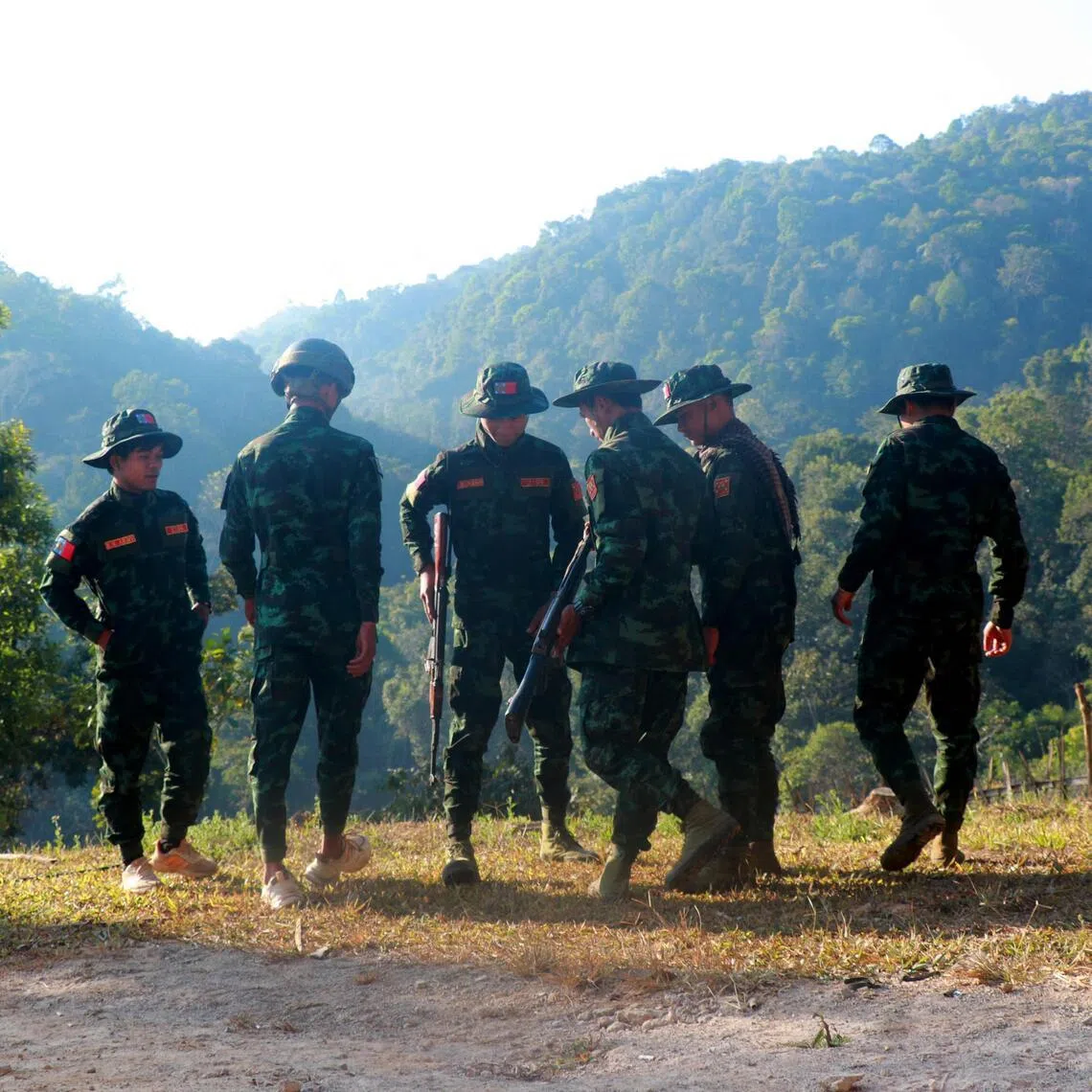 Fighters from Myanmar’s rebel Kayan National Army standing guard around their base camp in Pekon, in Shan state, on Jan 25.