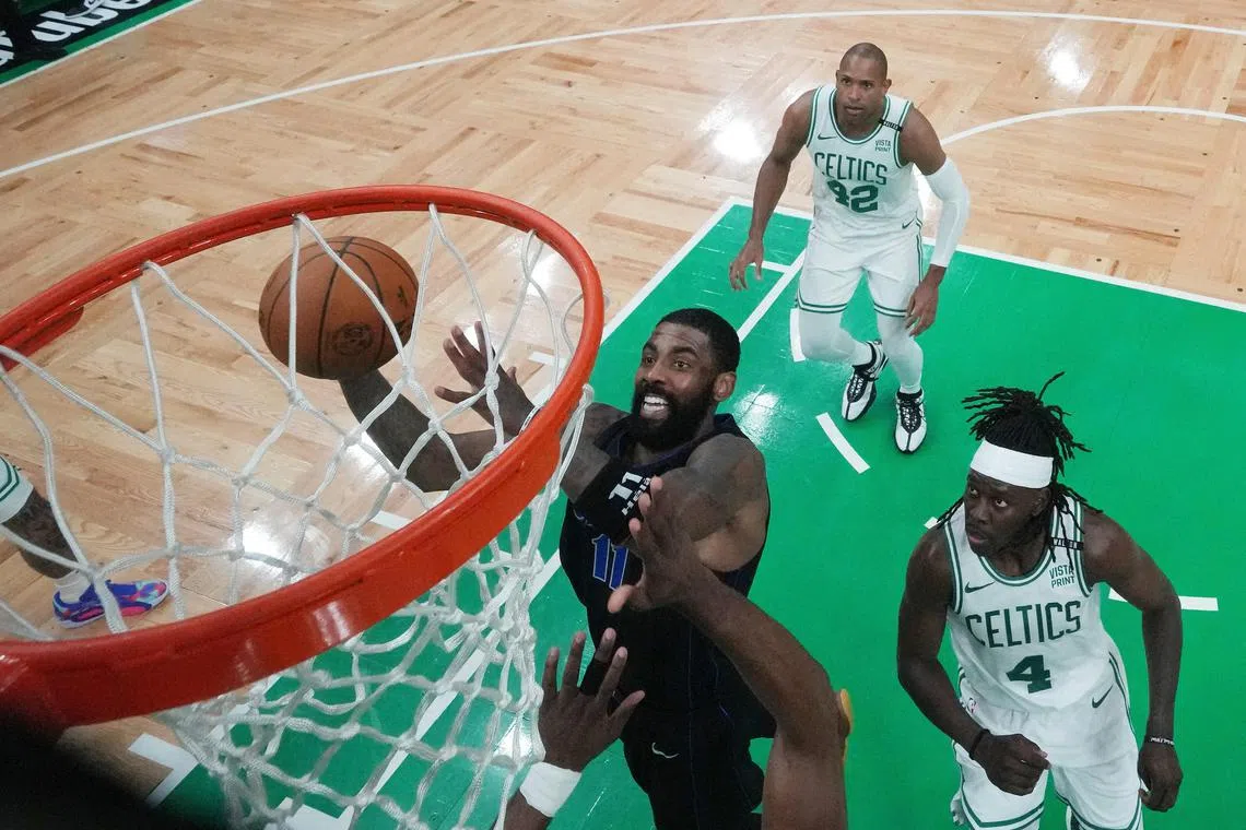 Boston Celtics guard Jaylen Brown (not pictured) blocks the shot of Dallas Mavericks guard Kyrie Irving during the third quarter of Game 1 of the NBA Finals.