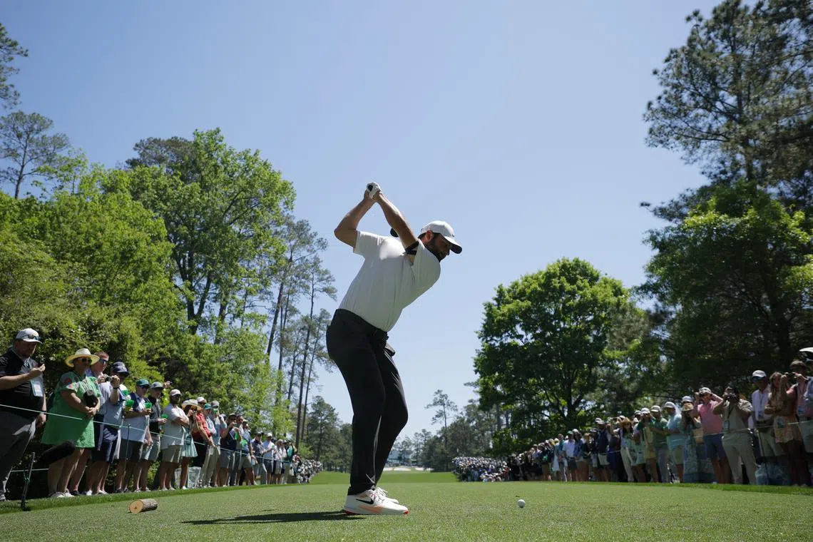 Golf - The Masters - Augusta National Golf Club, Augusta, Georgia, U.S. - April 8, 2025 Scottie Scheffler of the U.S. hits his tee shot on the 7th hole during a practice round REUTERS/Mike Blake