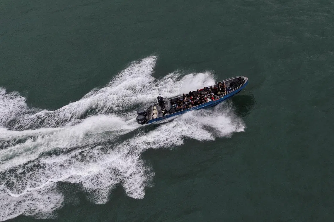 A drone view shows a boat bound for Colombia carrying Venezuelan migrants as it sails near the coast of Colon while they return to Venezuela following deportation, failed attempts to enter the United States amid renewed hopes of returning home following the U.S. capture of Nicolas Maduro and prospects for democratic elections and economic recovery, in Miramar, Panama, January 15, 2026. REUTERS/Enea Lebrun