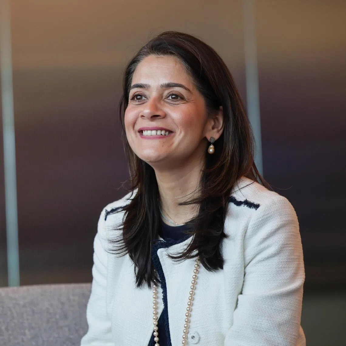 ST20251113_202502800865: Gin Tay/ ssstanchart/ Sharon Salim/ Portraits of Tanuj Kapilashrami, StanChart's Chief Strategy and Talent Officer; photographed at StanChart's MBFC Tower 1 office on Nov 13, 2025.