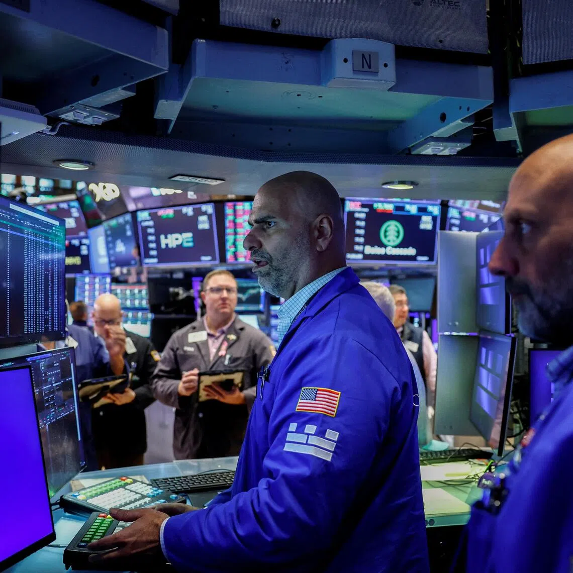 Traders working on the floor of the New York Stock Exchange, in New York City, on Sept 16.