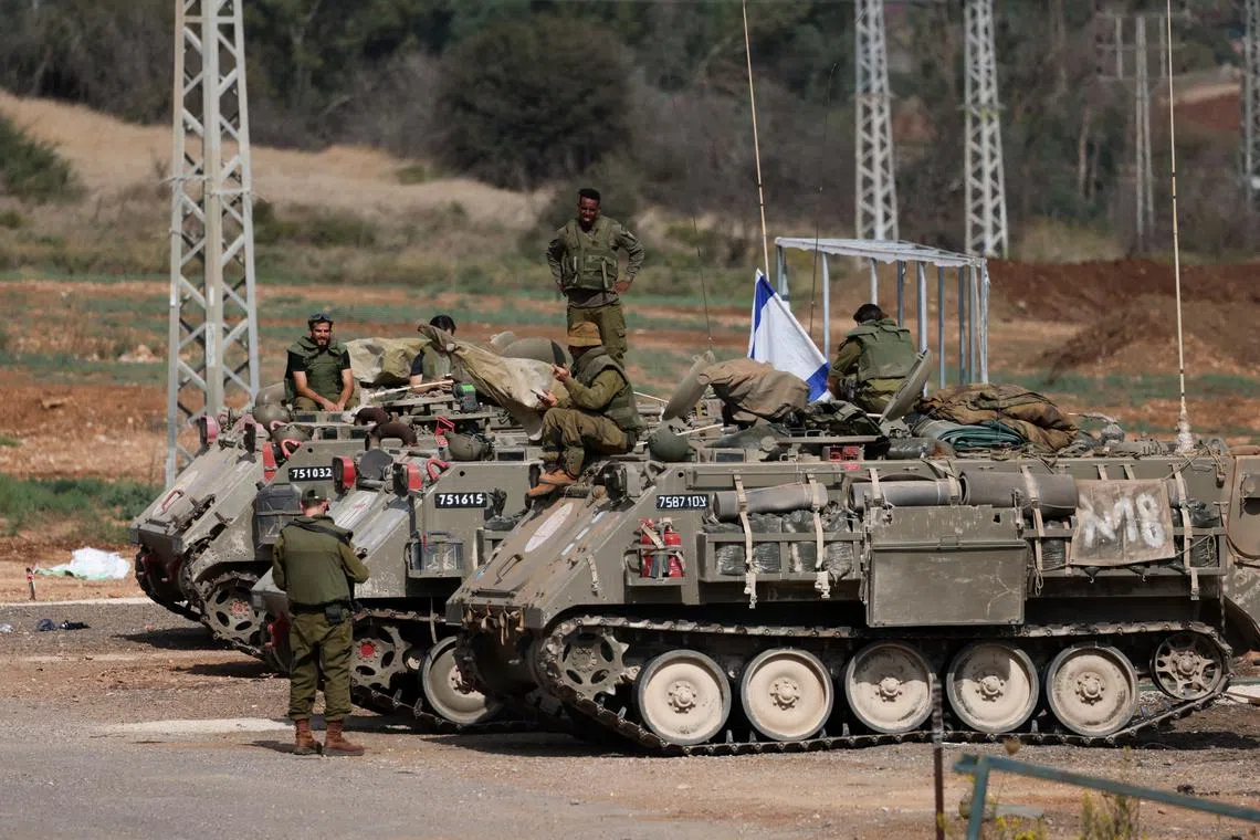 Israeli soldiers on deployment near Israel's border with Lebanon, in northern Israel, on Oct 31.