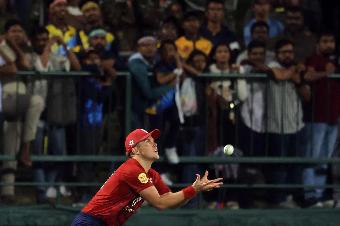 Cricket - Sri Lanka v England - Pallekele International Cricket Stadium, Pallekele, Sri Lanka - January 30, 2026 England's Sam Curran catches out Sri Lanka's Dhananjaya de Silva REUTERS/Lahiru Harshana