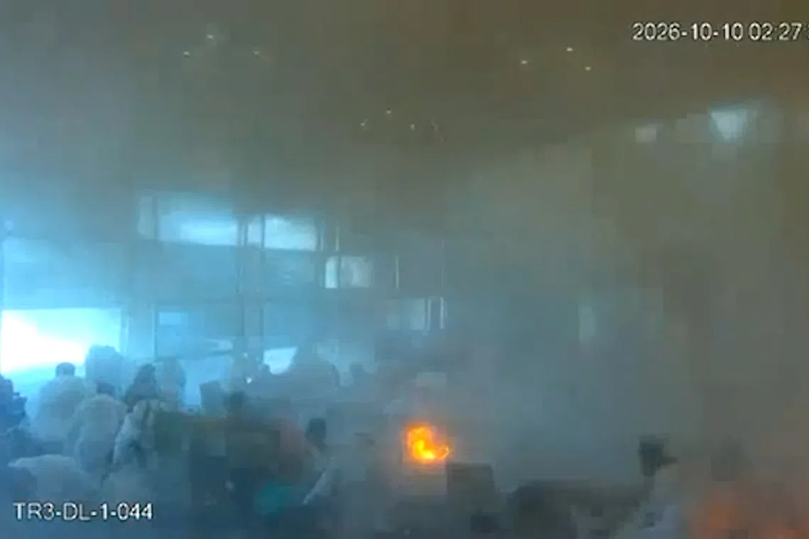 A screengrab taken from CCTV footage released by the Saudi Media Ministry shows the moment Riyadh’s international airport International was hit by a Houthi strike on Oct 10.