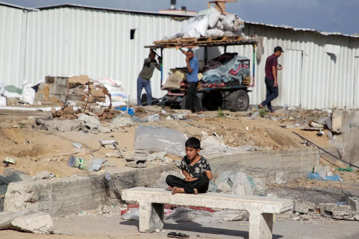 A boy looks on as Palestinians prepare to flee Rafah after Israeli forces launched a ground and air operation in the eastern part of the southern Gaza city, amid the ongoing conflict between Israel and Hamas, in Rafah, in the southern Gaza Strip May 12, 2024. REUTERS/Hatem Khaled
