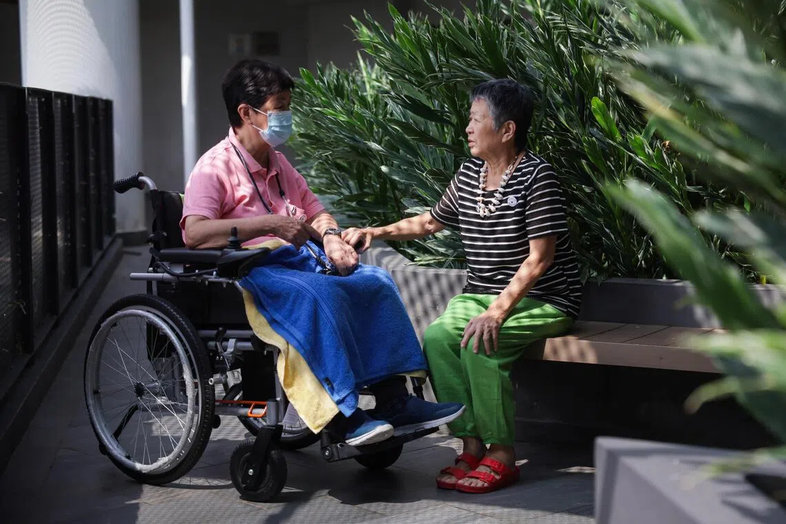 Priscilla Low (right) has been volunteering for over 20 years.