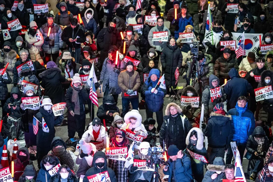 Supporters of impeached South Korea president Yoon Suk Yeol take part in a rally near his residence in Seoul on Jan 7. 