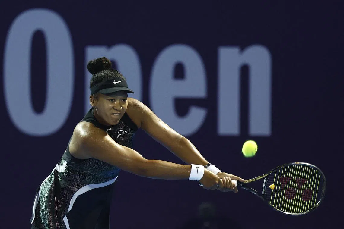 Japan's Naomi Osaka (above) in action against Croatia's Petra Martic in a last-32 match at the Qatar Open in Doha on Feb 13.