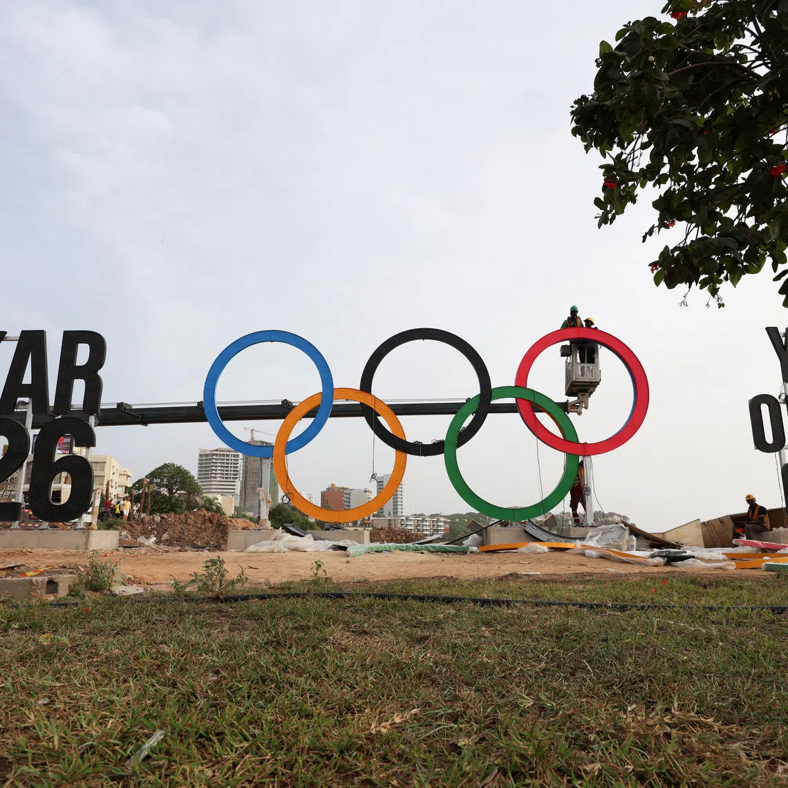 Workers assemble the Olympic rings as Senegal prepares to host the Youth Olympic Games, the first Olympic event to be held in Africa, in Dakar, Senegal, October 25, 2026. REUTERS/Misper Apawu