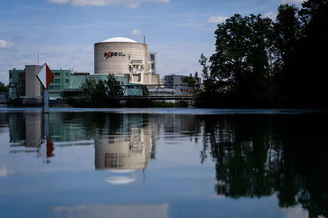 (FILES) This picture taken on July 9, 2019, shows a general view of Switzerland's Beznau nuclear plant near Dottingen. Switzerland's Beznau nuclear plant, one of the oldest in the world, will keep running until 2033, its operator announced on December 5, 2024, as environmentalists argued it should be shut down "immediately". (Photo by Fabrice COFFRINI / AFP)