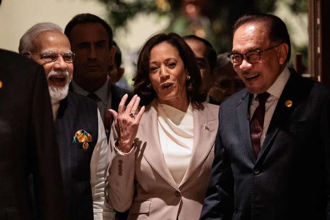 US Vice-President Kamala Harris (centre) talks with India's Prime Minister Narendra Modi (left) and Malaysia’s Prime Minister Anwar Ibrahim in Jakarta.