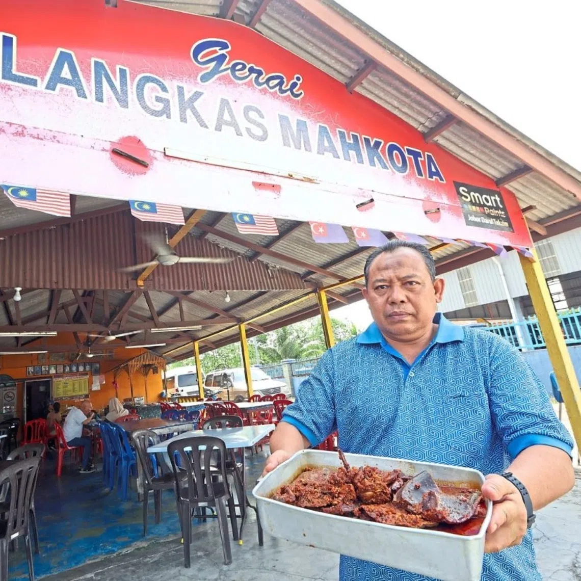 Mr Mohd Khair with the sambal horseshoe crab at his restaurant in Kota Tinggi.