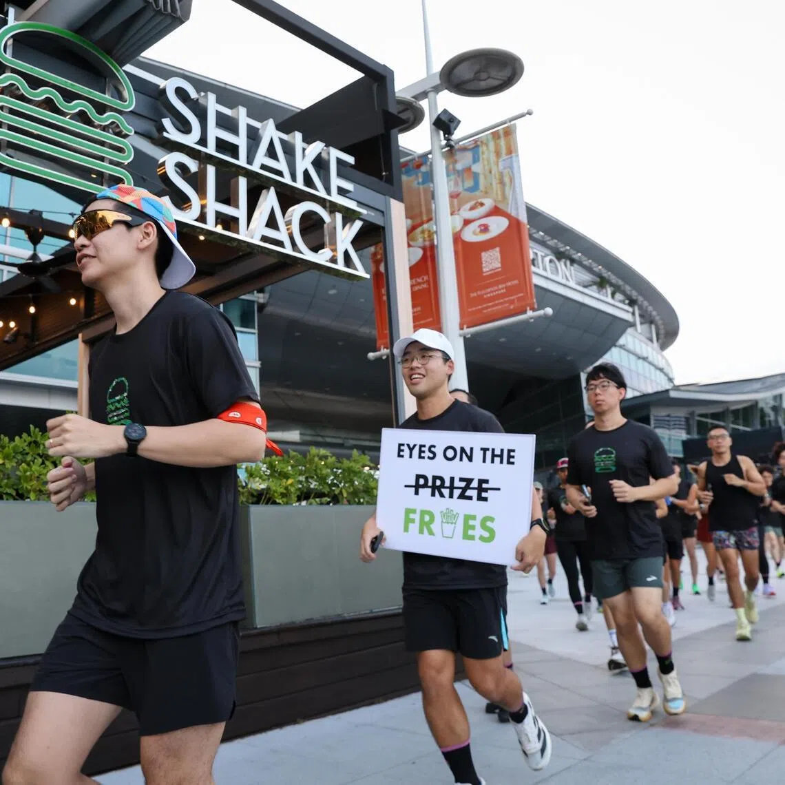 Members of the Shack Track Club getting off to a running start during the 7km Shack Run which began from Shake Shack One Fullerton on July 4.